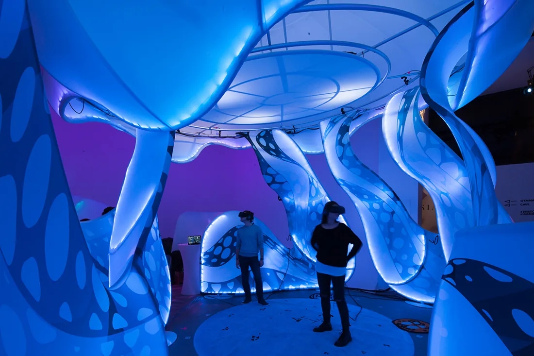 Visitors exploring immersive VR installations at Impact Reality